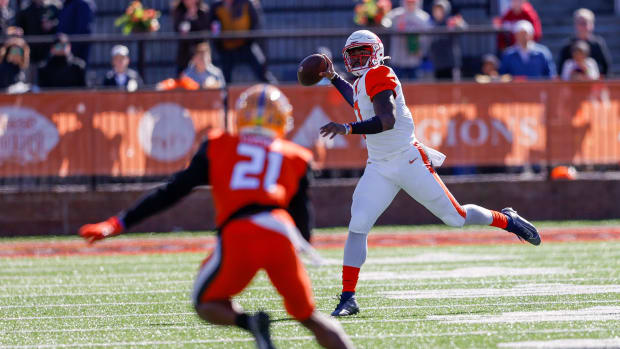 Feb 5, 2022; Mobile, AL, USA; American squad quarterback Malik Willis of Liberty (7) drops back to pass in the first half against the National squad at Hancock Whitney Stadium. Mandatory Credit: